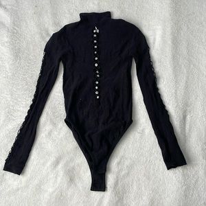 Fashion Nova black body suit with cut outs.